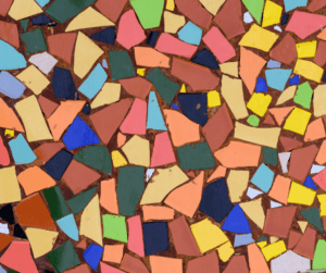 Broken brightly colored pottery used to make a mosaic.