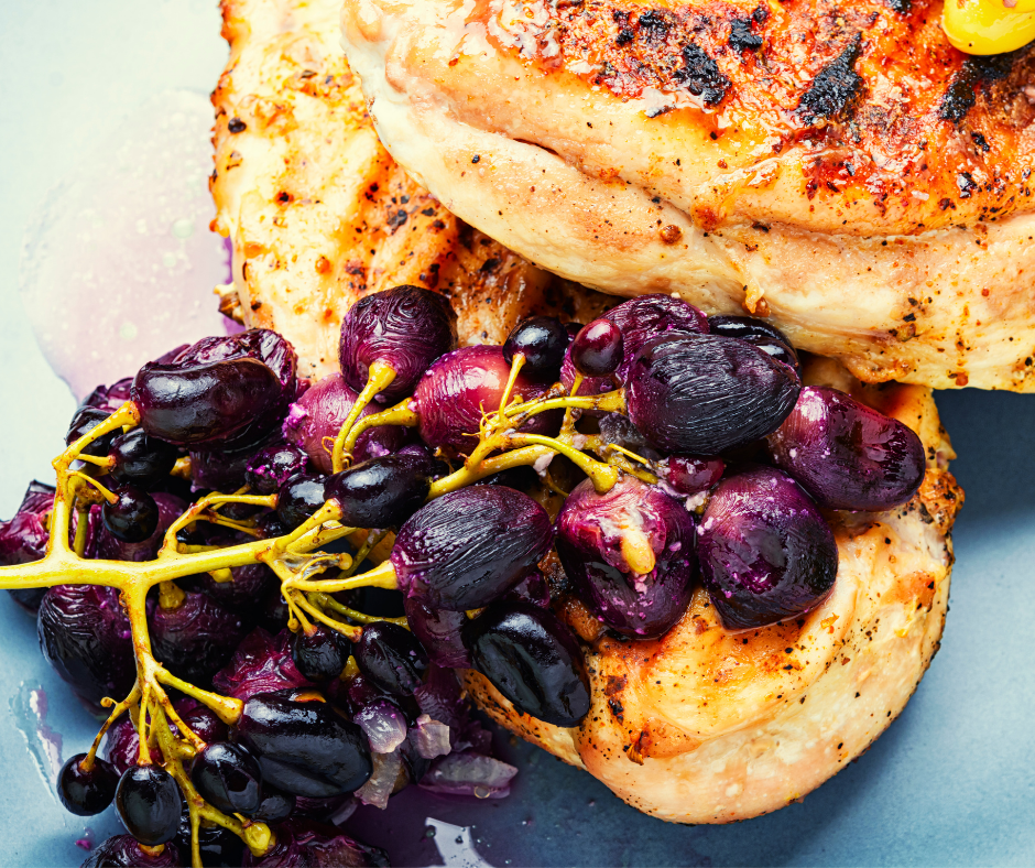 Roasted grapes with baked chicken breast.