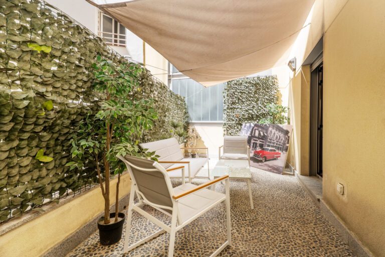 Creating a private peaceful retreat on a patio with fake plants.