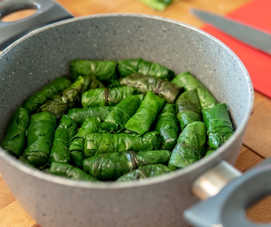 stuffed grape leaves read in pot.