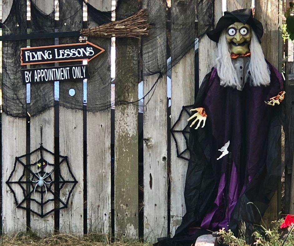 Witch themed Halloween decor idea with cute signs
