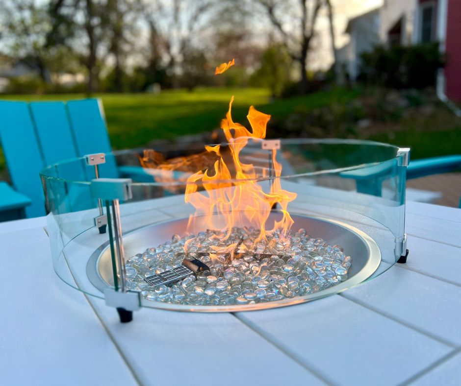 Propane table top fire pit with safety guard.