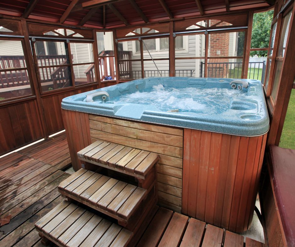 A private backyard hot tub enclosed in a gazebo.
