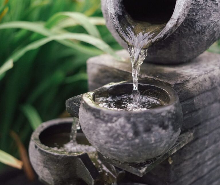 A small multi tiered water fountain.