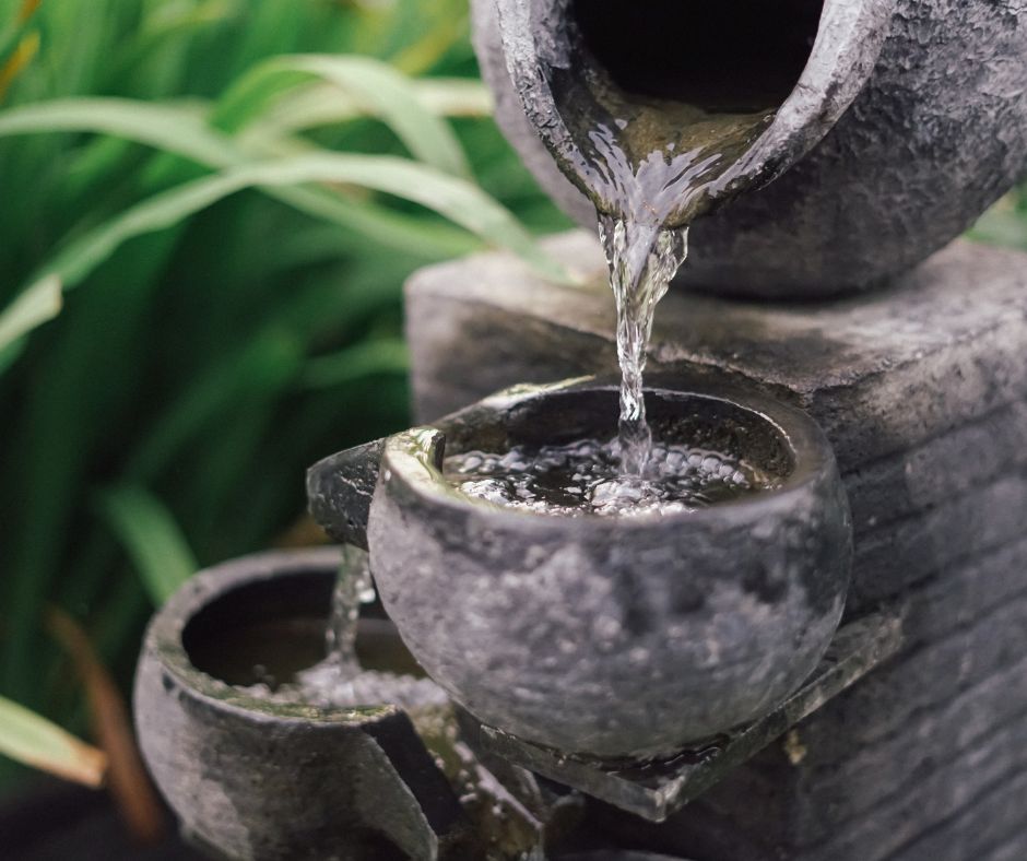 A small multi tiered water fountain.
