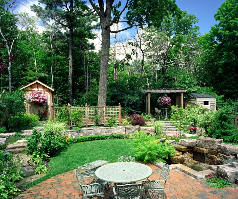 A large backyard with a variety of microclimates. Including a central full sun sitting area next to water feature. A sitting area shaded by a pergola and a variety and trellises and hardscape.
