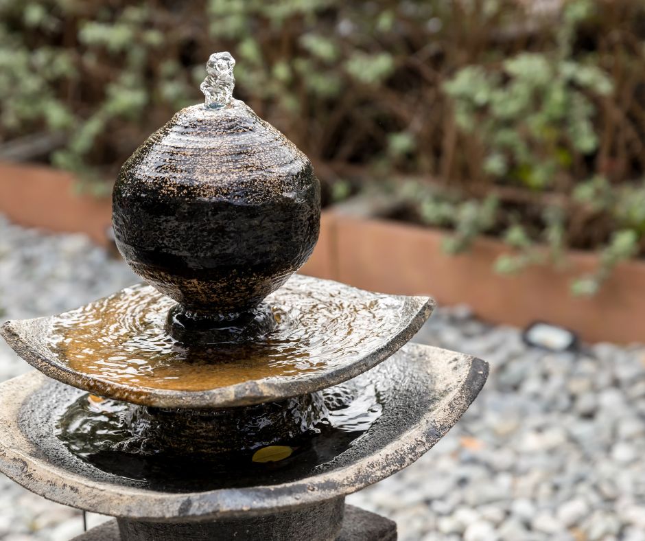 Three tiered stone water fountain.