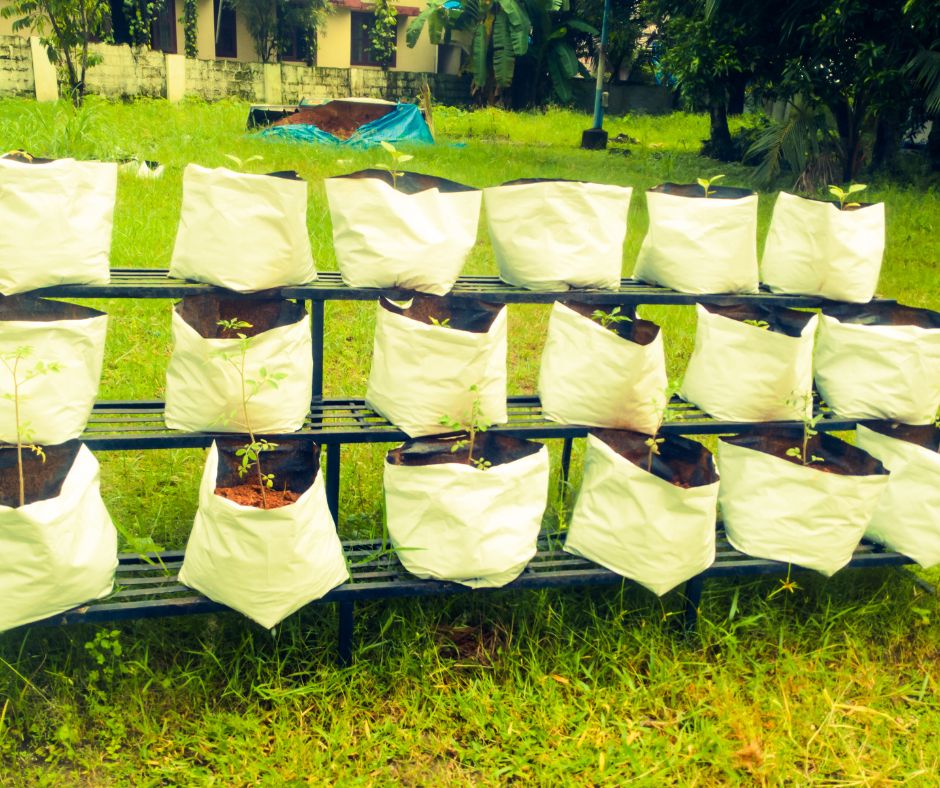 A multi tiered grow bag setup featuring 18 white garden grow bags.