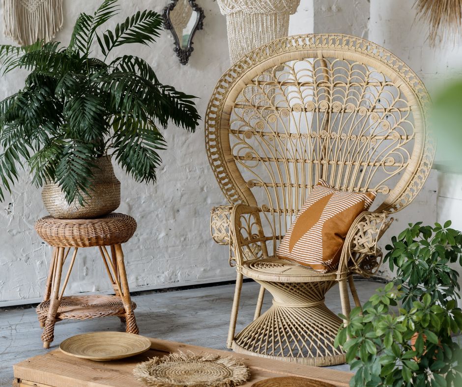 Wicker chair and side table and potted plants.