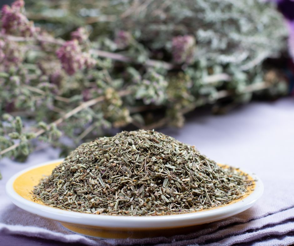 A yellow dish of dried Herbs de Provence.