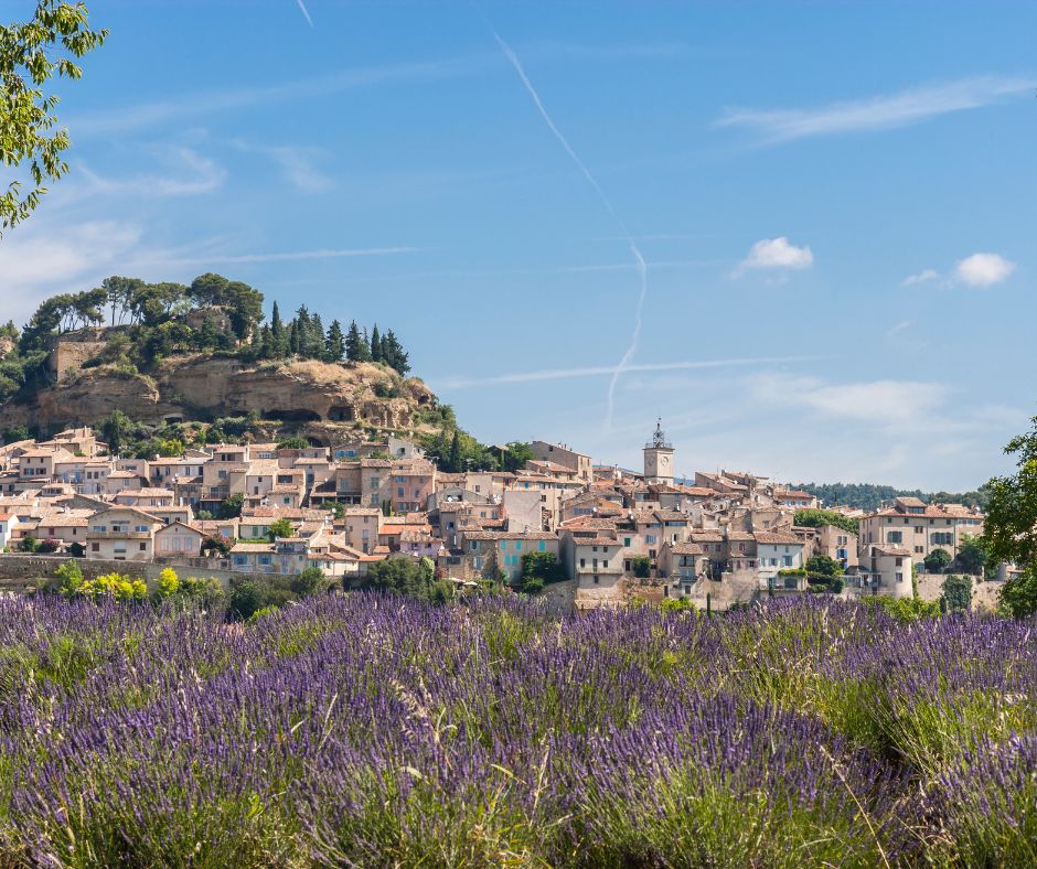 Provence (France). Provençal village between Manosque and Cavaillon with a neighboring lavender field. 