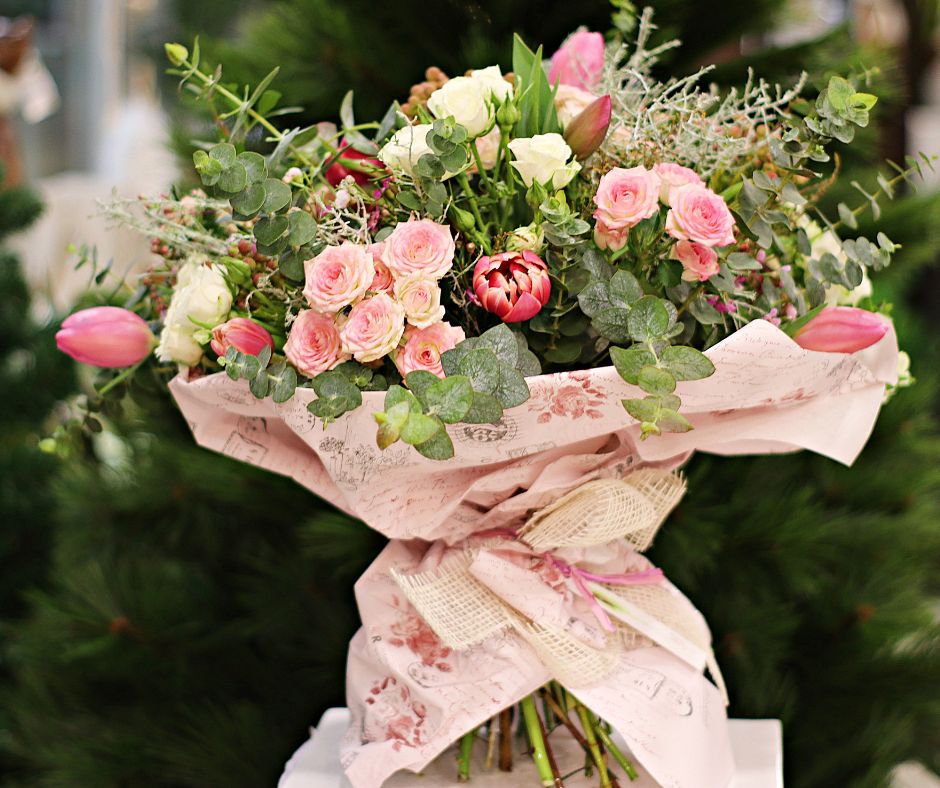 A classic pink spring bouquet including roses, tulips and eucalyptus. 