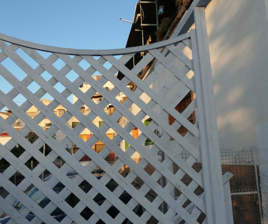 A white free standing lattice privacy panel.