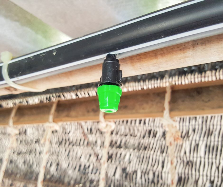 A green tipped patio mister.