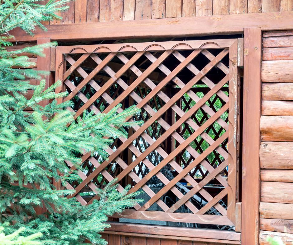 A wooden window cover made of lattice.
