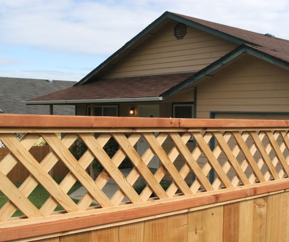 A wood fence with lattice added to the top for additional patio privacy.