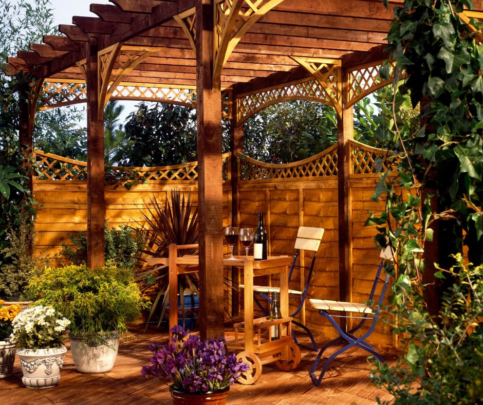 A wooden pergola with additional privacy provided a lattice topped fencing.