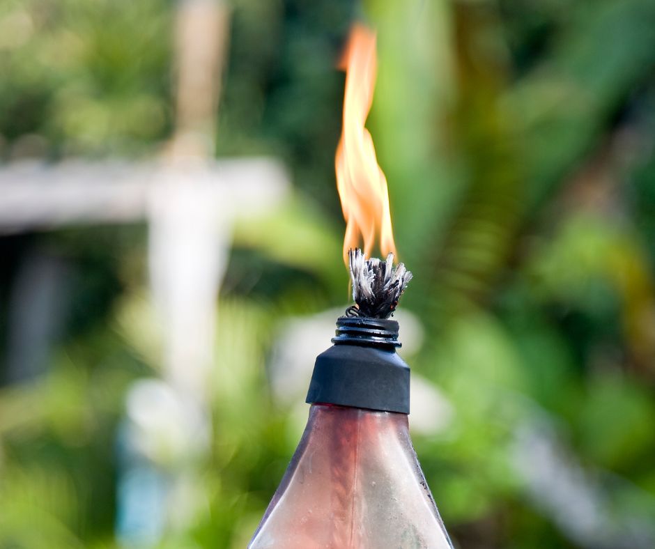 A burning glass table top torch.