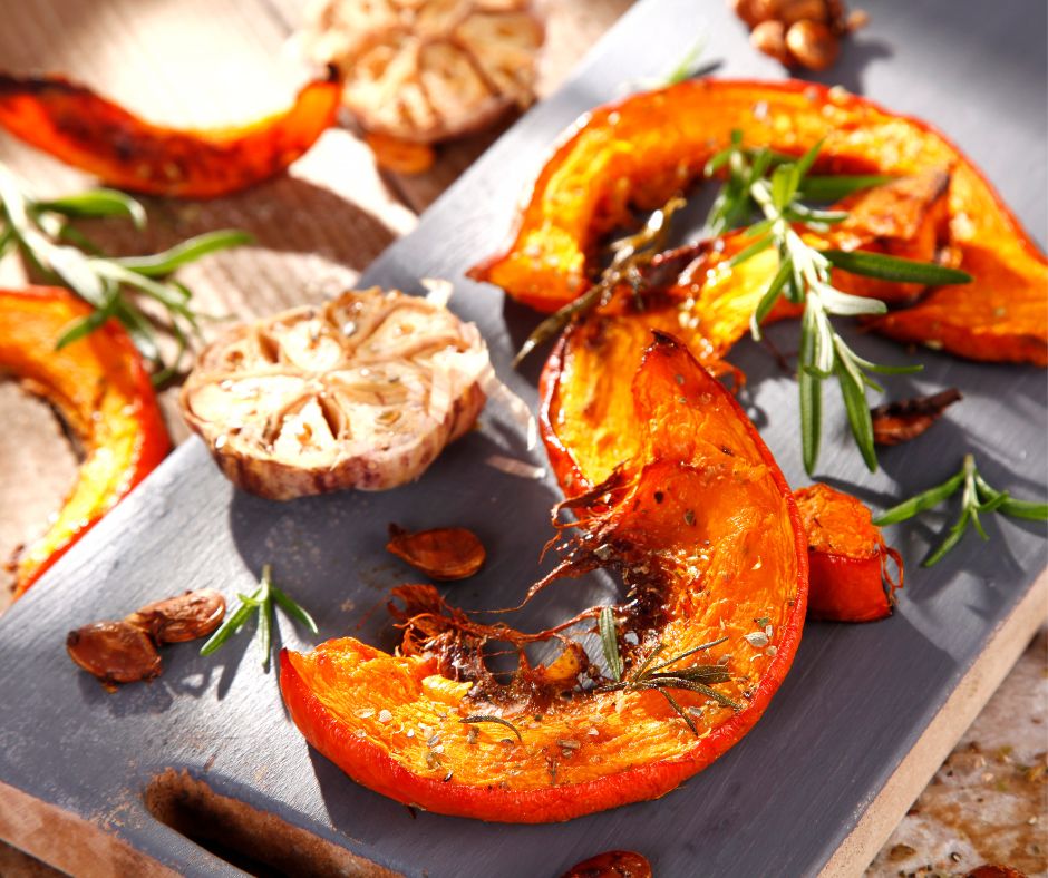 Bright orange roasted butternut squash with garlic and rosemary.