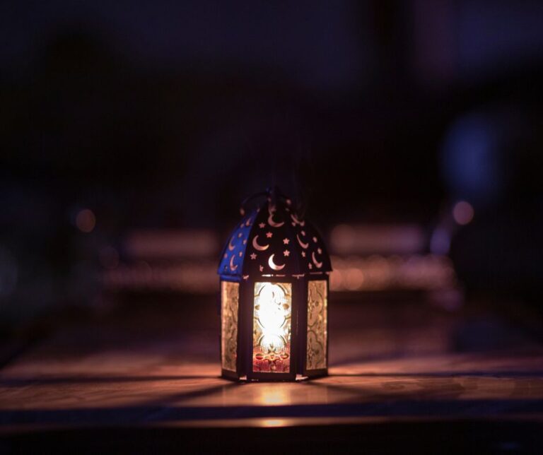 A small metal mosquito repelling citronella latern.