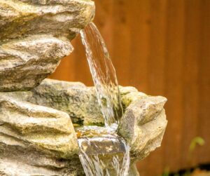 Water fall between two levels of a water fountain.