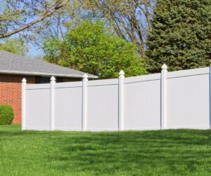 A white close board vinyl fence.