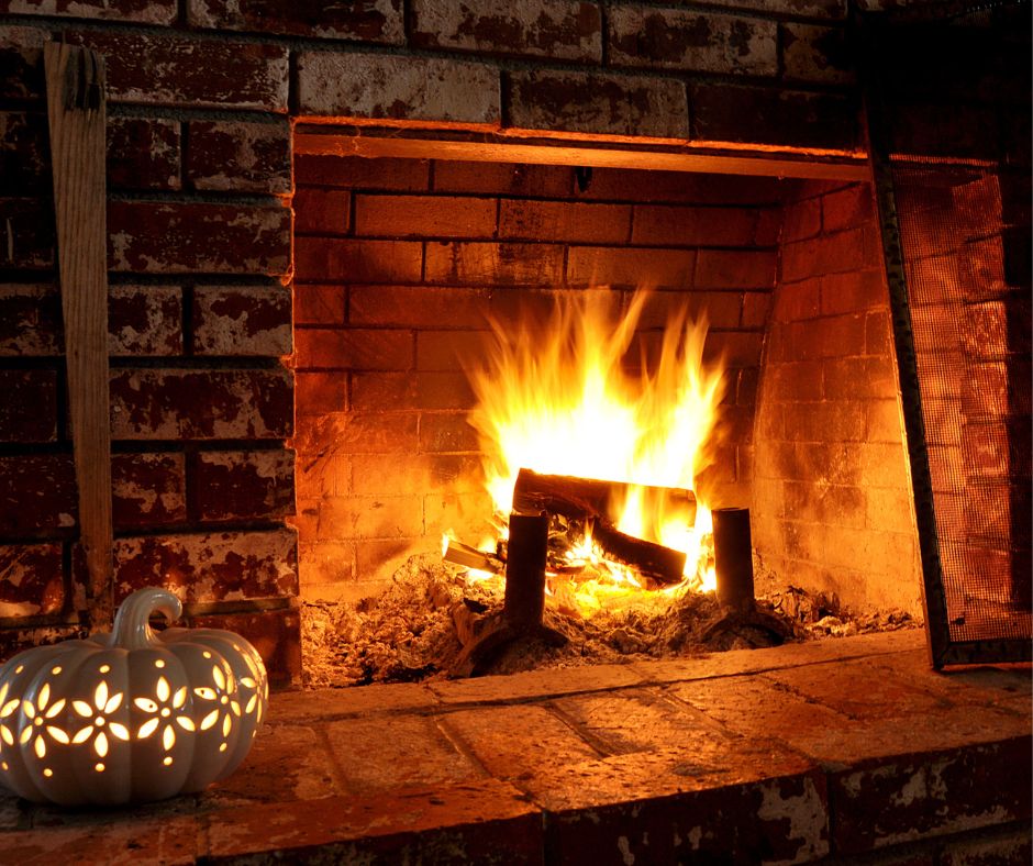 A fire burning in an outdoor fireplace.