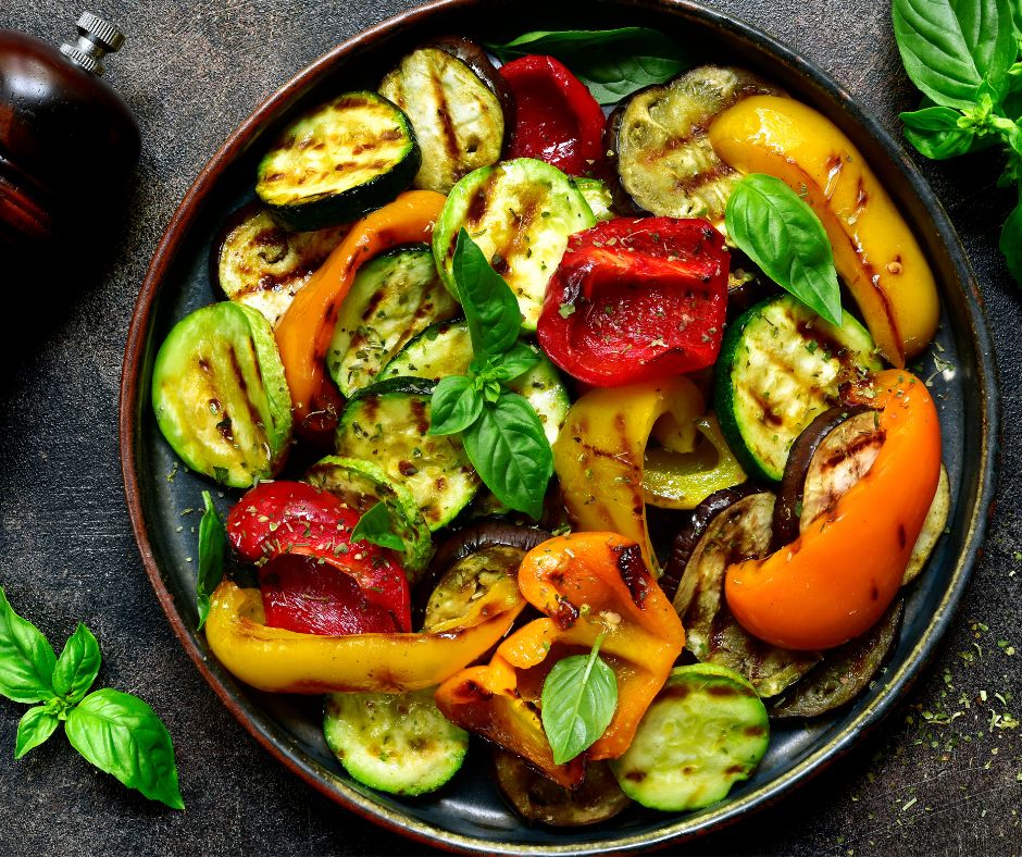 A colorful plate of grilled vegetables from a garden.