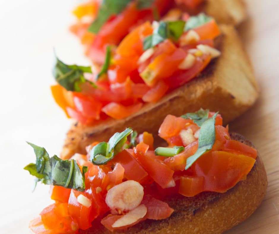 Fresh tomatoes and basil on bread.
