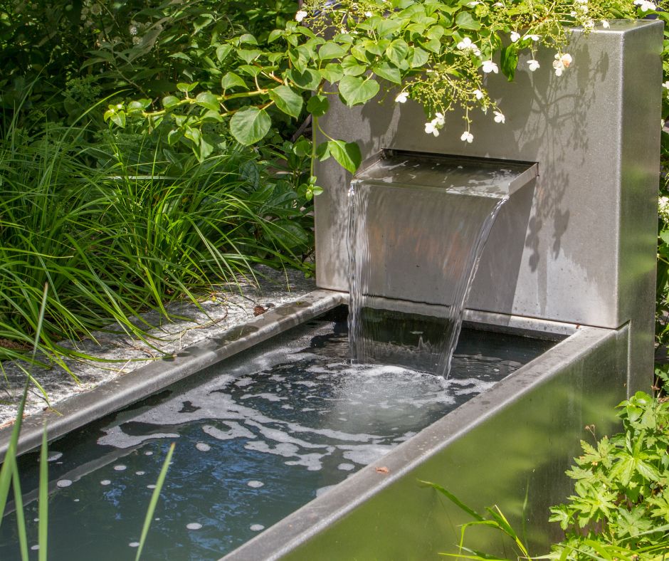 A cement garden water fountain.