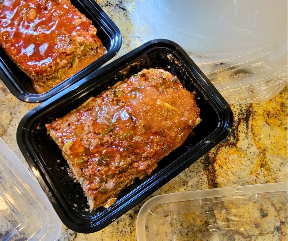Two portions of meatloaf being prepped for the deep freezer.
