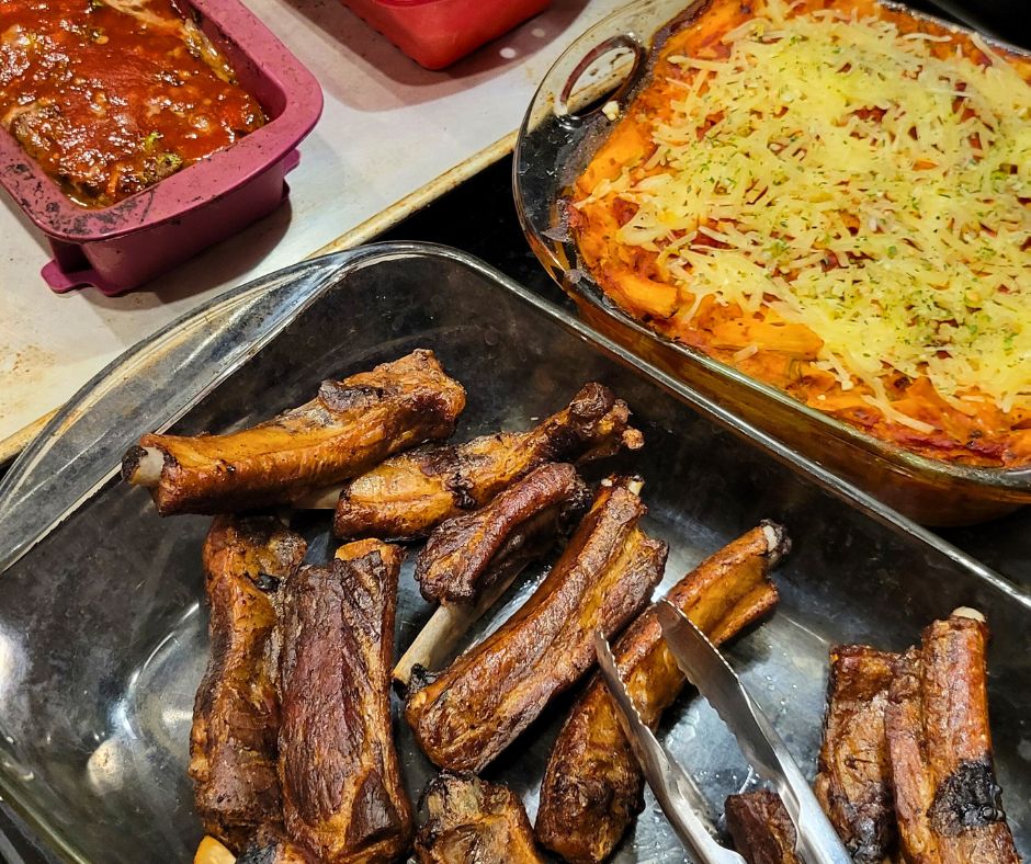 Pork party ribs, baked ziti, and meatloaf weekly meal prep dishes ready for the freezer.