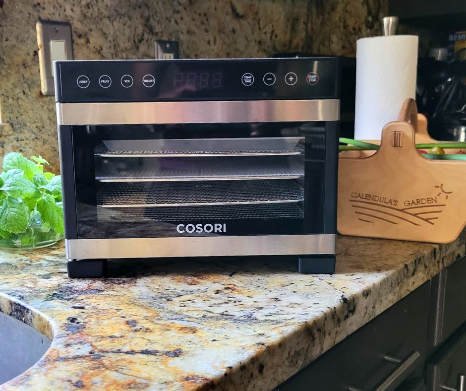 A counter top Cosori food dehydrator.