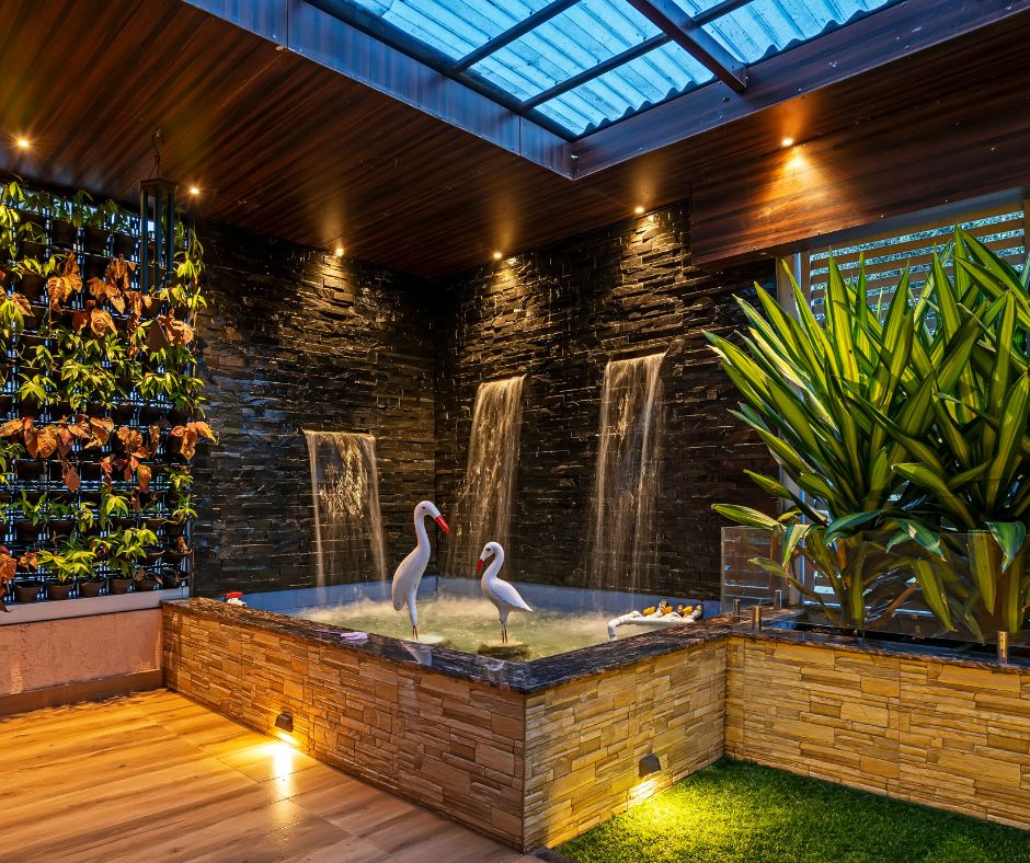 A relaxing indoor spa area with a hanging garden and indoor plants.