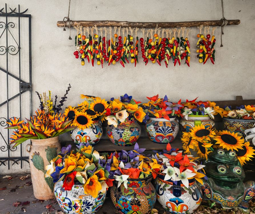A stand selling brightly colors southwestern decorations.
