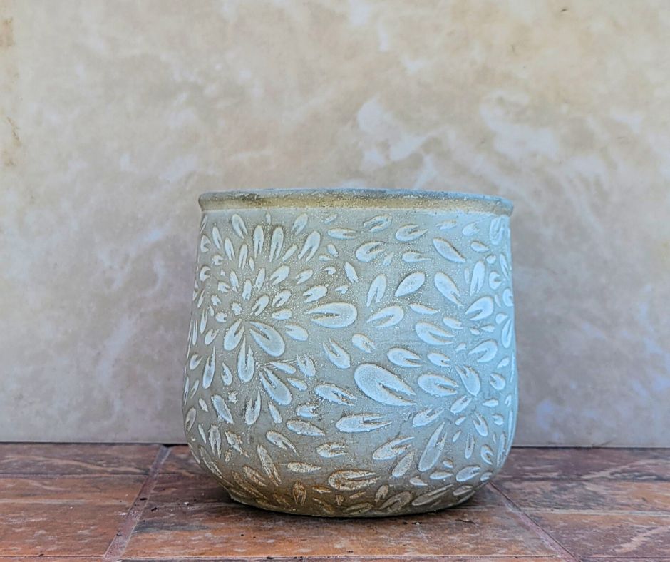 A white and grey unglazed pot.