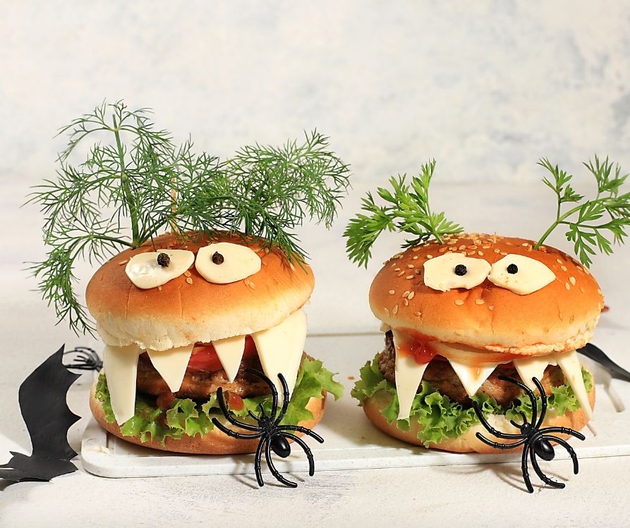 Sandwiches garnished with fresh herbs and eyes.