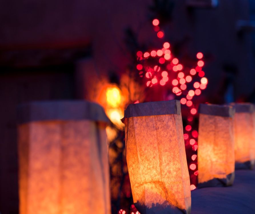 The holiday decorations of a home in the desert southwest included red string lights and luminarias.