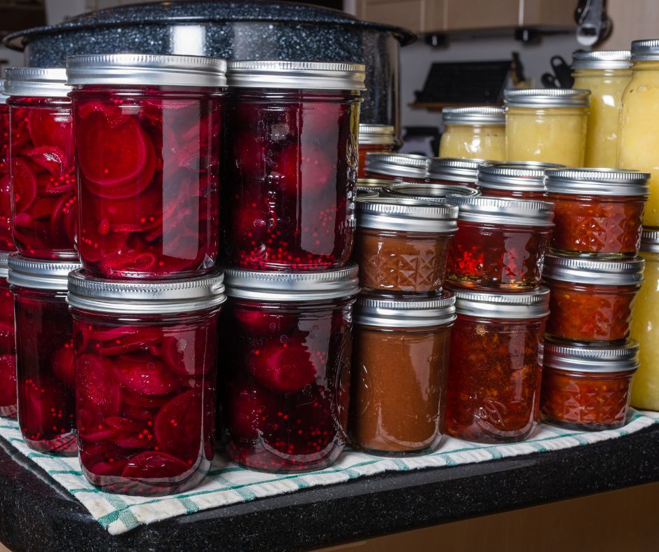 A large assortment of home canned veggies in jars ready for an emergency food pantry.