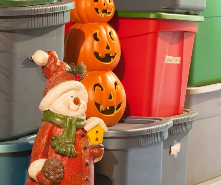 Holiday decoration stored next to plastic storage bins.