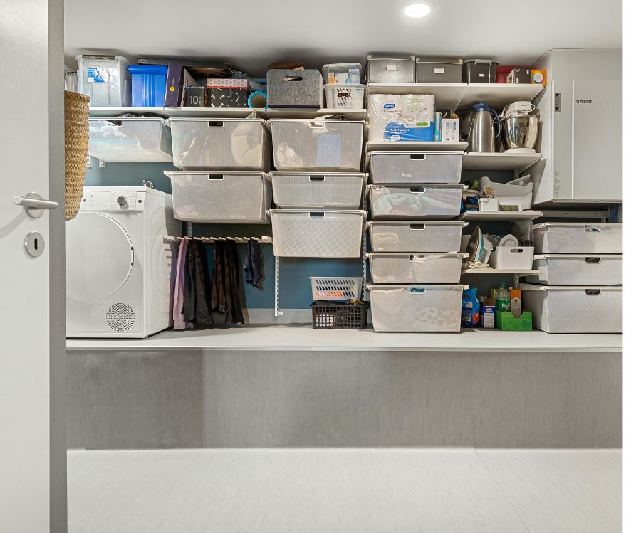 Wall mounted storage utilizing space around a washer.