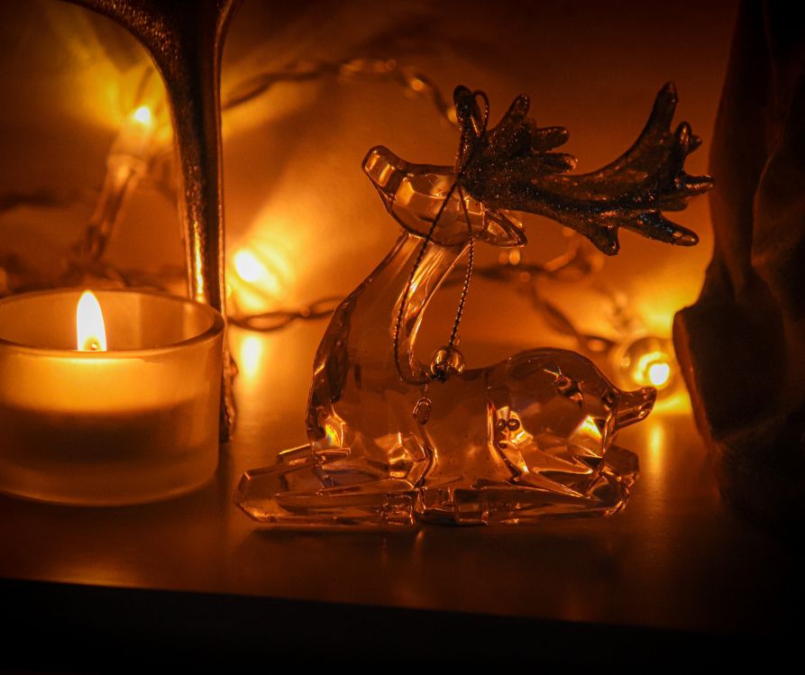 Holiday decorations highlighted by small tealight candles.