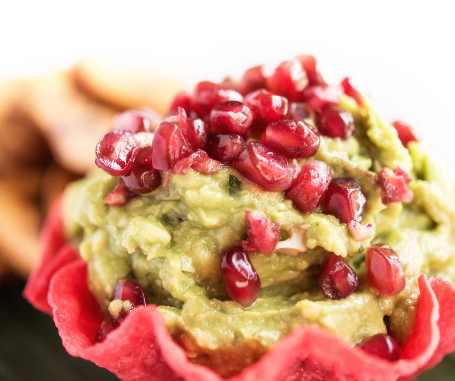 Guacamole topped with fresh pomegranates.