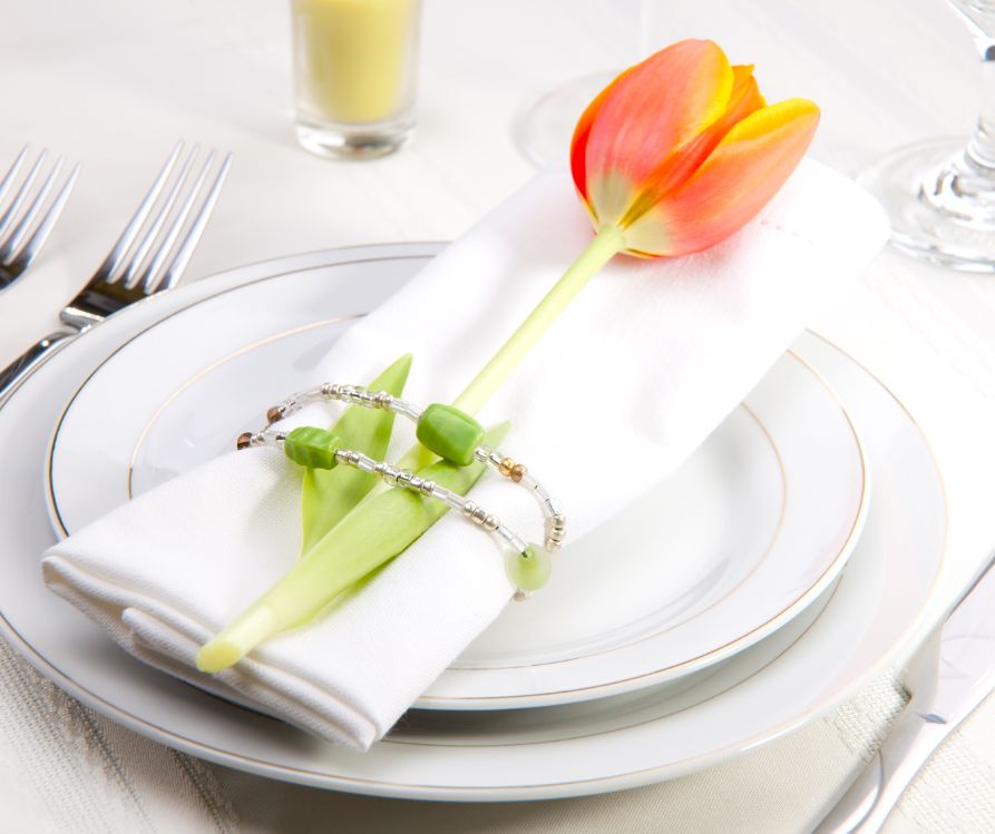 An orange tulip table setting accent.