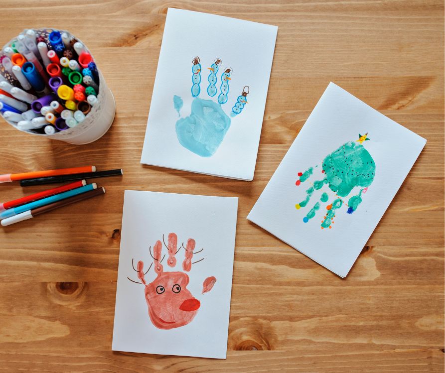 Winter themed crafty handprint drawings.
