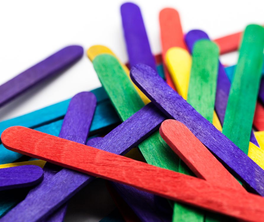 A pile of brightly colored popsicle sticks.