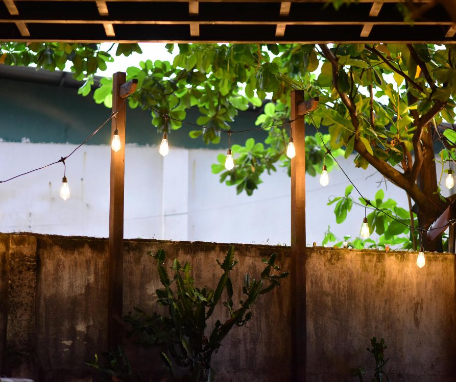 Large string lights on a private covered patio.