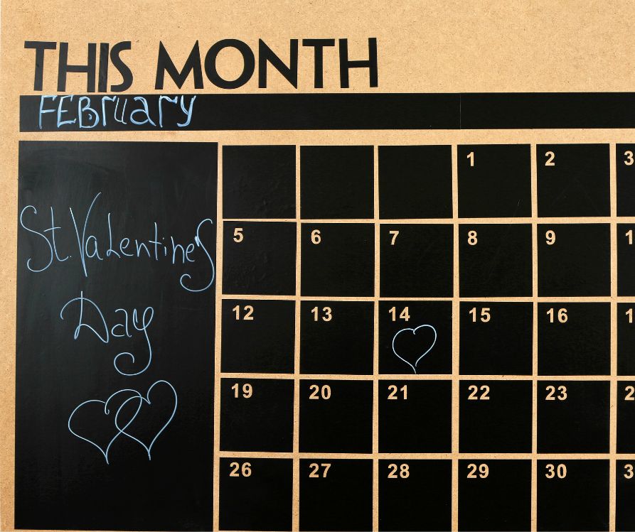 Chalkboard Wall Calendar with Mark on 14 February.
