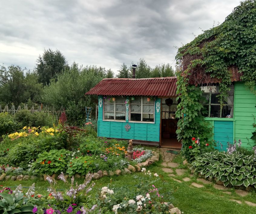 Charming Cottage Garden with Flowers and Greenery
