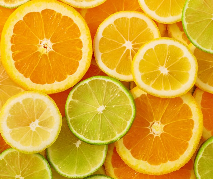 A wide variety of citrus slices including oranges, limes and lemons.